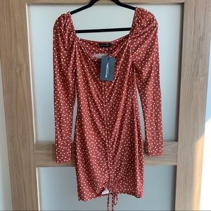 Orange and white polka dot dress